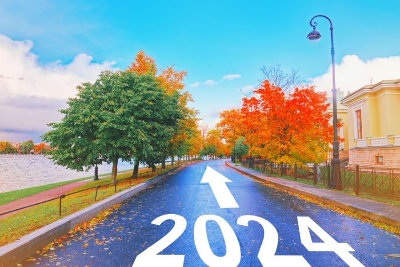 2024 on a road with fall trees in background