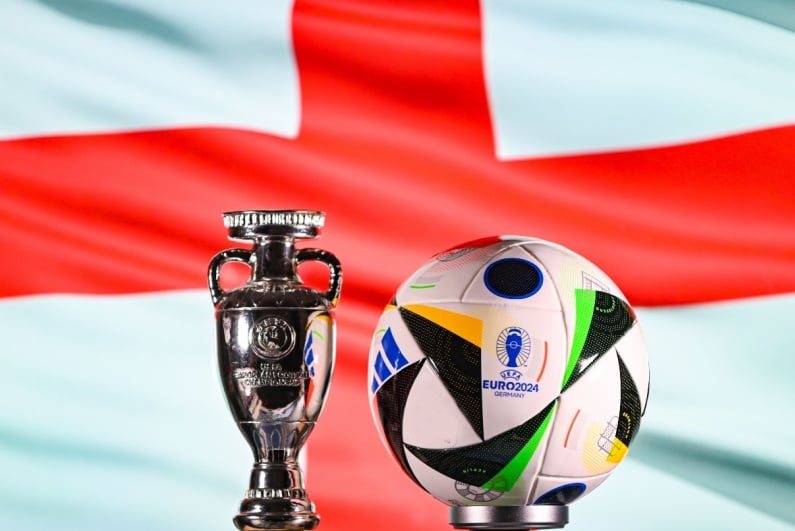 Euro 2024 soccer ball with England flag in background