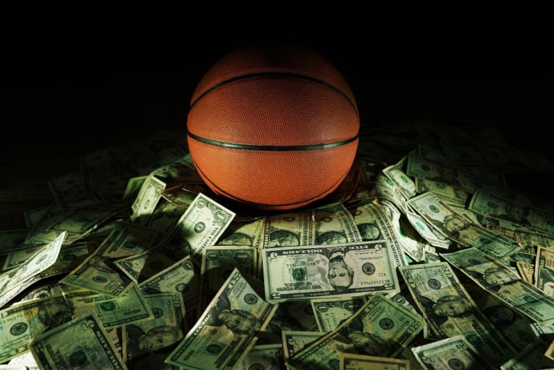 Basketball on a pile of cash