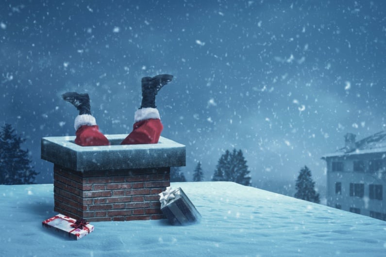 Santa's legs sticking out of chimney