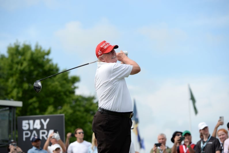Donald Trump hitting golf ball