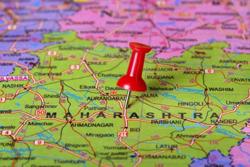 Pushpin pointing to Maharashtra on a map of India