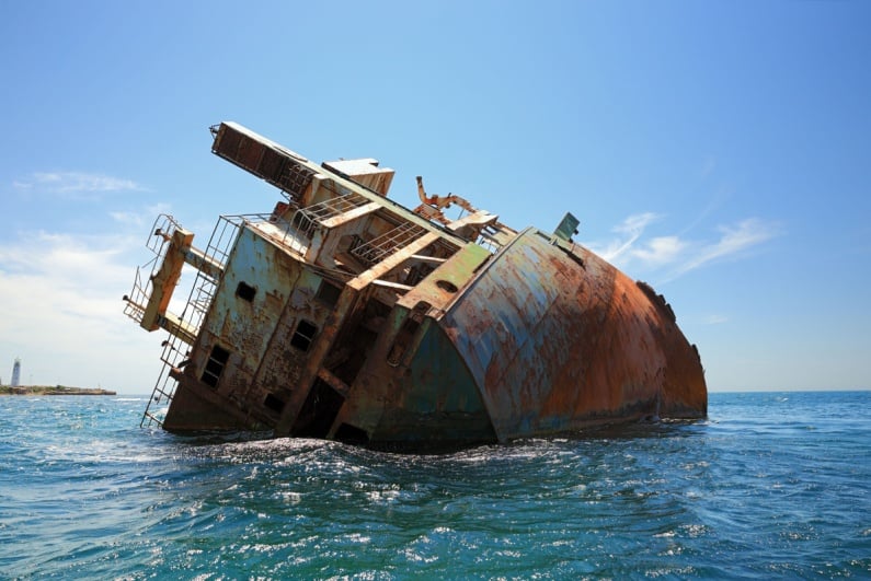 Rusted sinking ship