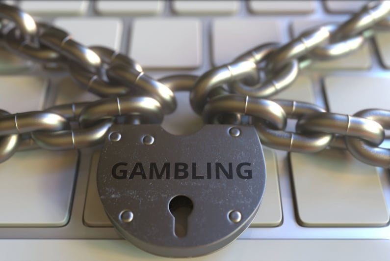 Gambling padlock on laptop keyboard