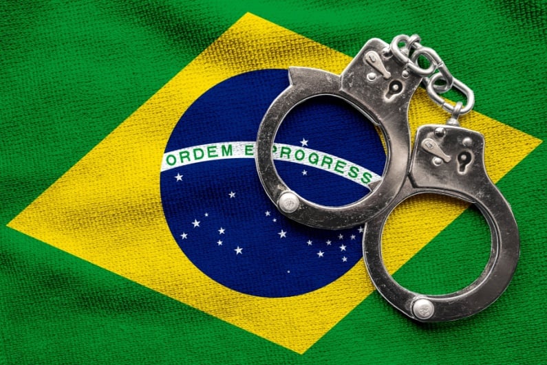 Handcuffs on Brazilian flag