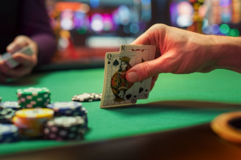 Poker player looking at cards