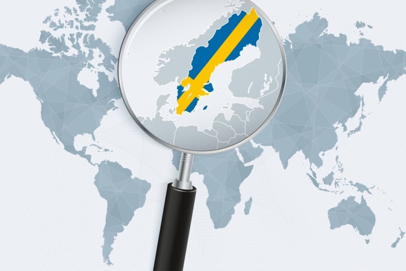 Magnifying glass on map of Sweden