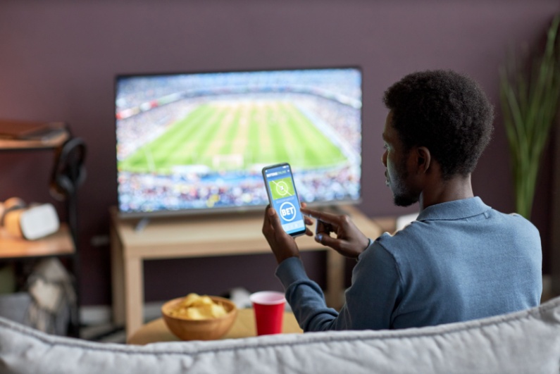 Man betting on the couch