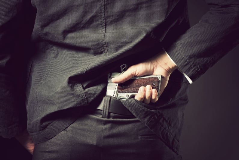 Man hiding gun in waist