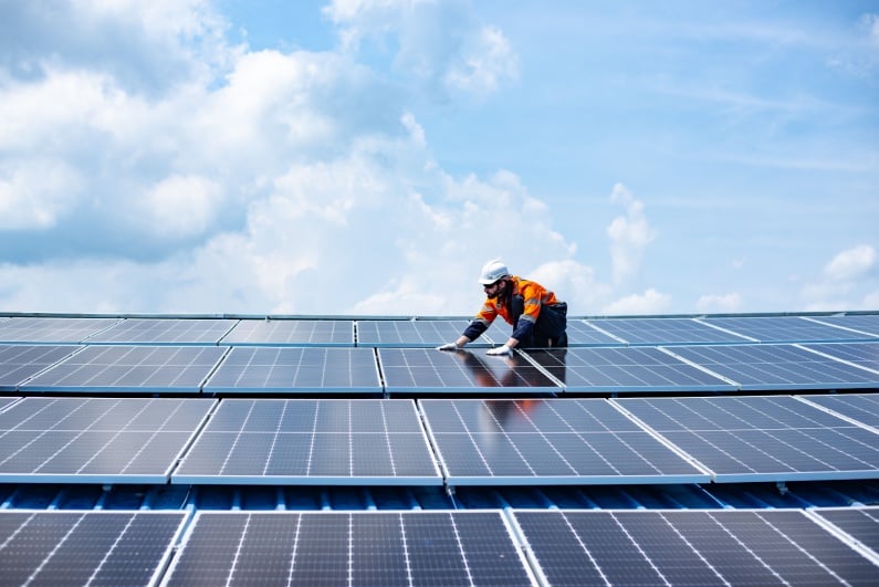 Man installing solar panels