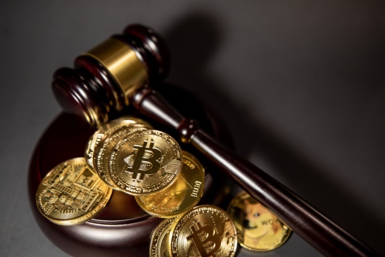 Wooden gavel with bitcoin