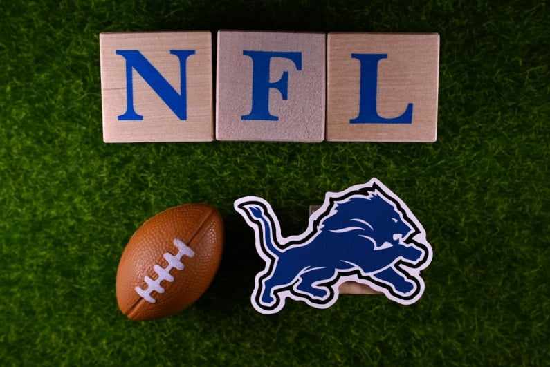 NFL sign with ball and Lions badge