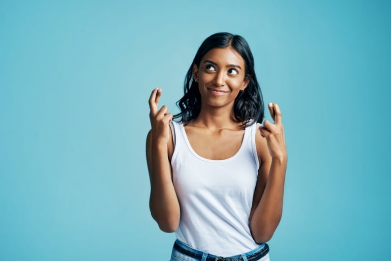 Woman with crossed fingers