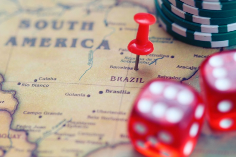 Dice and chips on map of Brazil