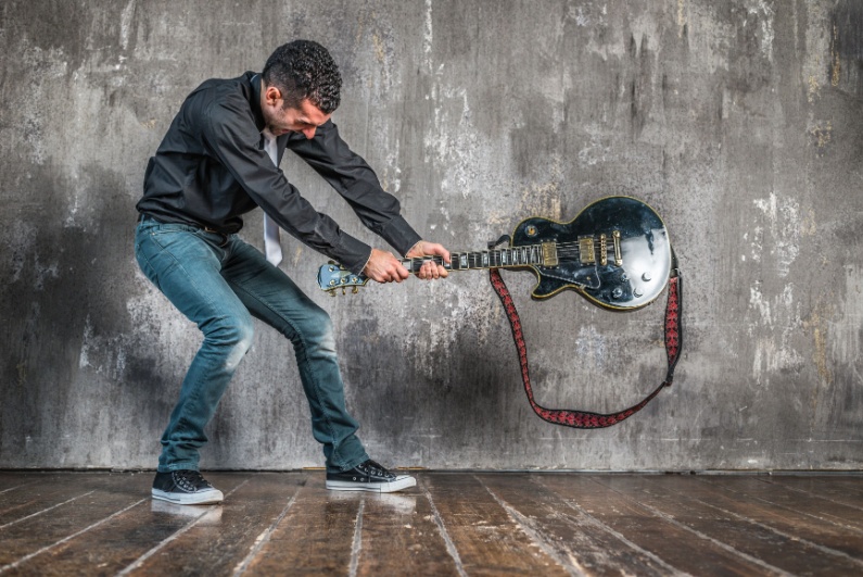 Man smashing guitar