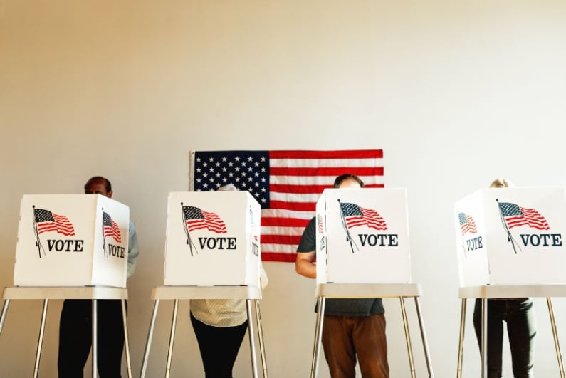 People at US voting booths