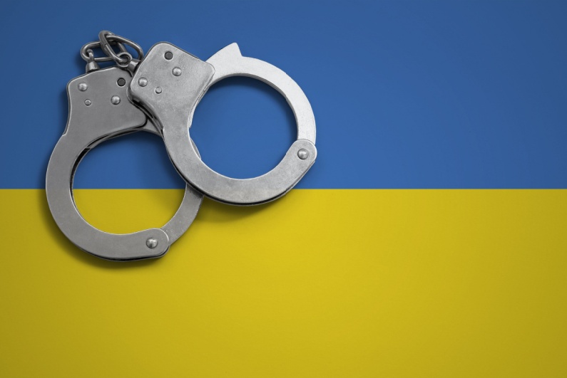 Handcuffs on Ukraine flag