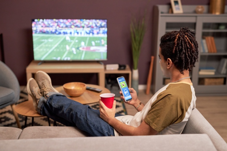 Man watching football on his couch