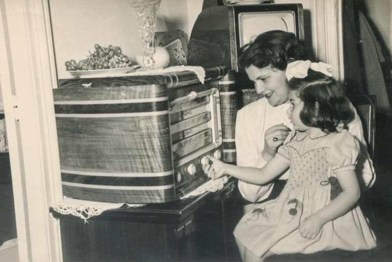 Mother and daughter listening to radio in 1955