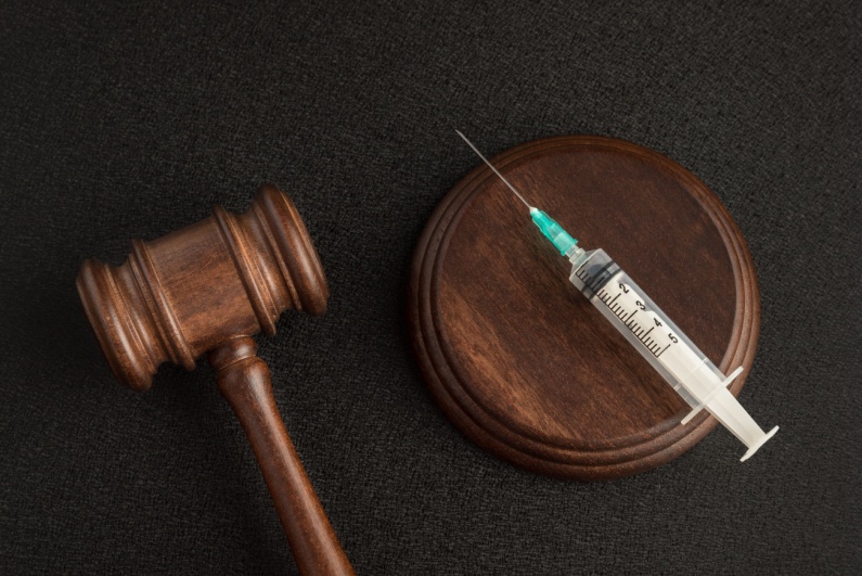 Injection with wooden gavel