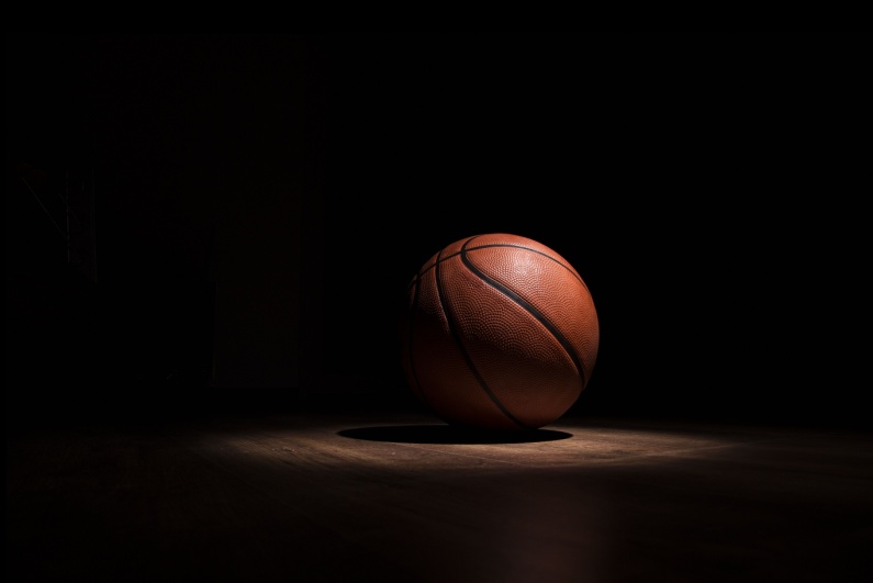 Basketball on dark court