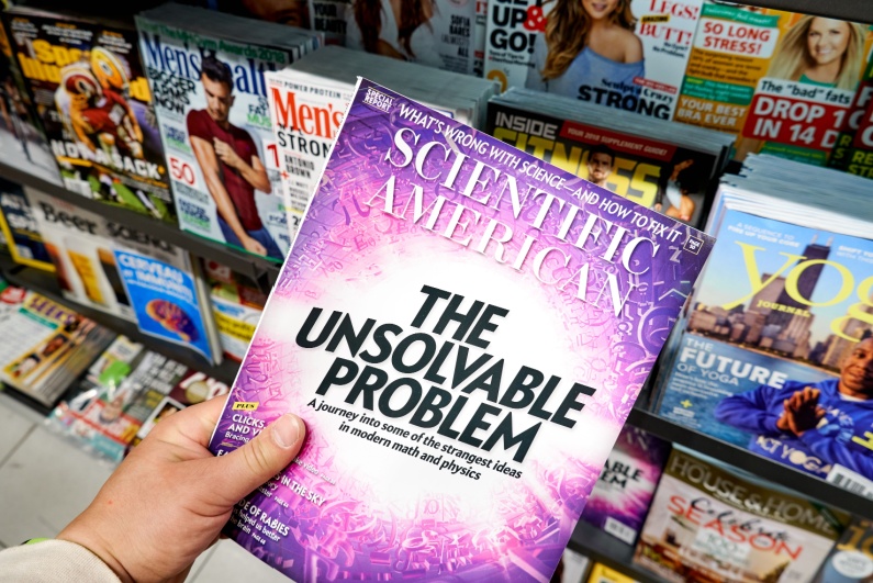 Man perusing Scientific American newsstand