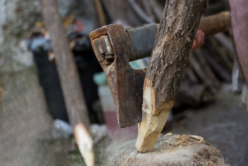 Axe cutting wooden stake