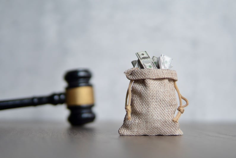 Gavel and bag of money