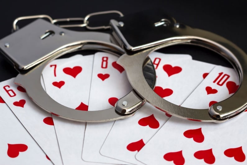 Handcuffs on playing cards