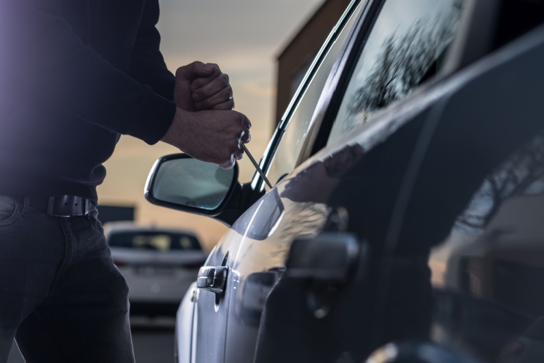 Man breaking into car