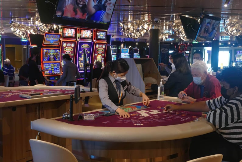 Casino gamblers wearing protective masks