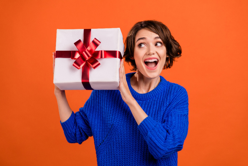 Happy woman holding gift