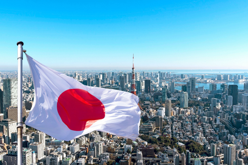 Japanese flag with Tokyo in background