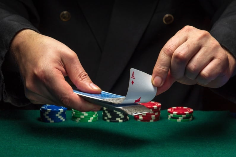 Person pulling cards from deck